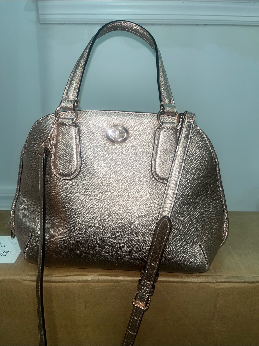 Coach Prince Street Mini Satchel in rose gold metallic leather. Turn lock.
